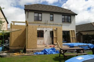 home with an extension being built