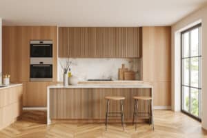 White kitchen interior with hardwood floor